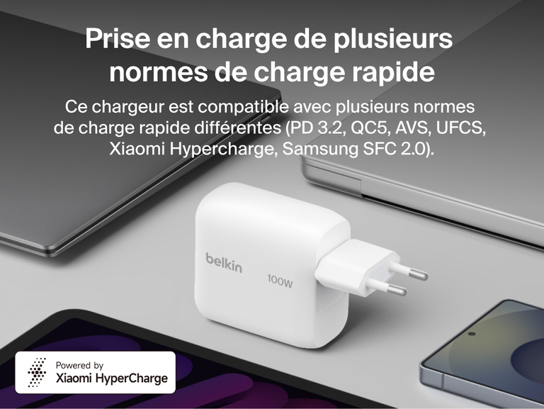 BoostCharge USB-C GaN Wall Charger 100W displayed with laptops, tablet, and smartphone to highlight multi-brand fast charging compatibility with PD3.2, QC5, Samsung SFC 2.0, and other charging protocols