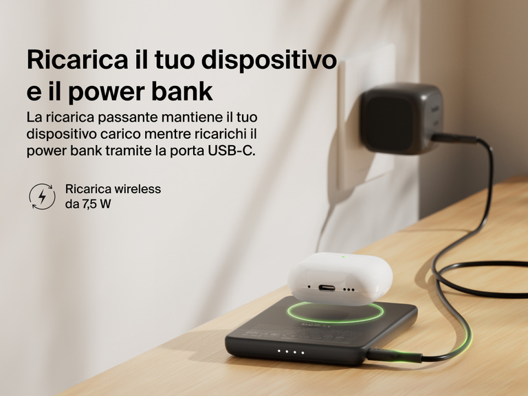Belkin BoostCharge Slim Magnetic Power Bank 5K shown wirelessly charging earbuds while recharging via USB-C, demonstrating 7.5W pass-through charging functionality.