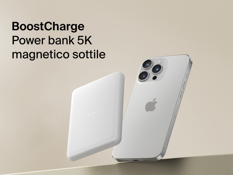 Belkin BoostCharge Slim Magnetic Power Bank 5K shown magnetically attached to a smartphone beside a slim wallet accessory, highlighting its compact portable charging design.