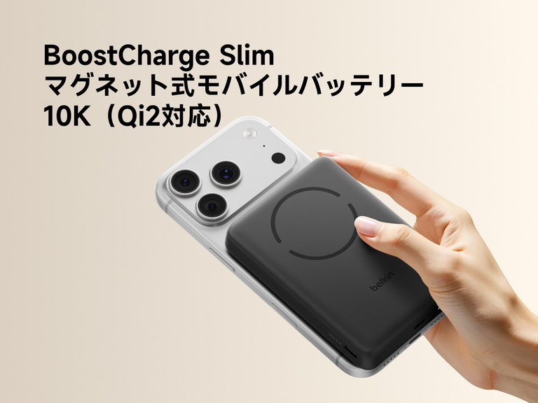 Slim Magnetic Power Bank 10K with Qi2 magnetically attached to smartphone held in hand demonstrating wireless charging alignment