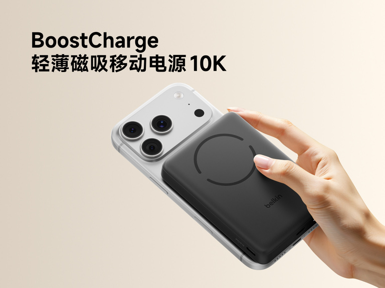 Slim Magnetic Power Bank 10K with Qi2 magnetically attached to smartphone held in hand demonstrating wireless charging alignment