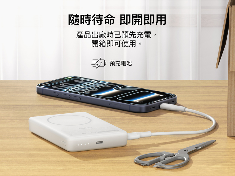 Slim Magnetic Power Bank 10K with Qi2 charging smartphone on desk with precharged battery indicator lights visible
