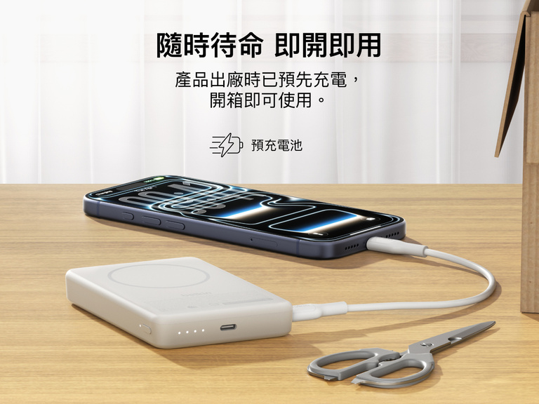 Slim Magnetic Power Bank 10K with Qi2 charging smartphone on desk with precharged battery indicator lights visible