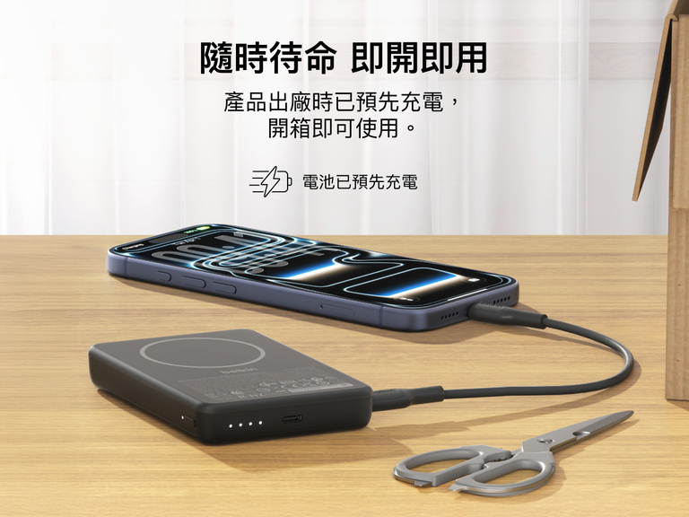 Slim Magnetic Power Bank 10K with Qi2 charging smartphone on desk with LED battery indicators and precharged readiness