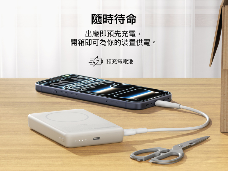 Slim Magnetic Power Bank 10K with Qi2 charging smartphone on desk with precharged battery indicator lights visible