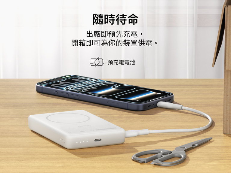 Slim Magnetic Power Bank 10K with Qi2 charging smartphone on desk with precharged battery indicator lights visible