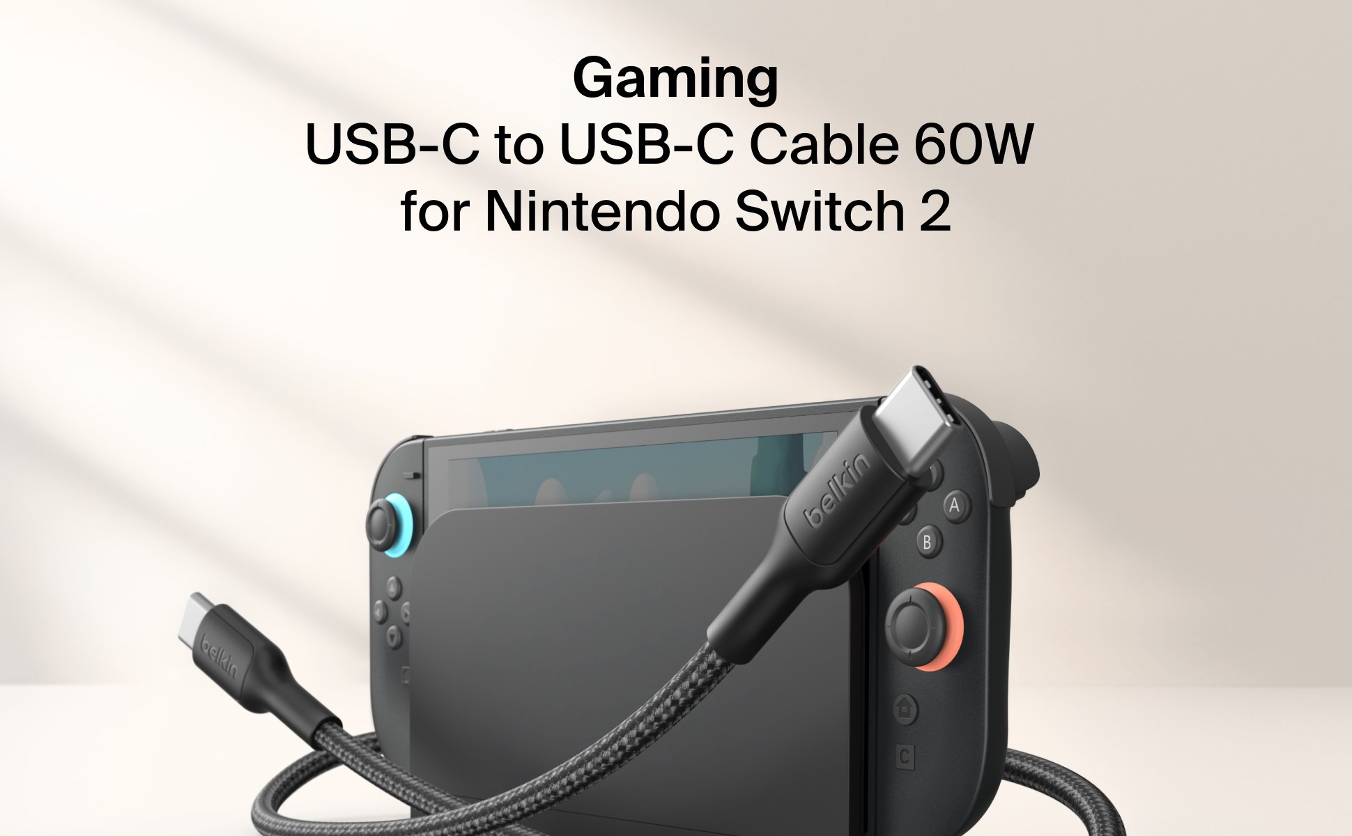 Belkin Gaming USB-C to USB-C Cable 60W is shown connected to a Nintendo Switch 2, offering fast, durable charging with braided construction for gaming-ready performance.