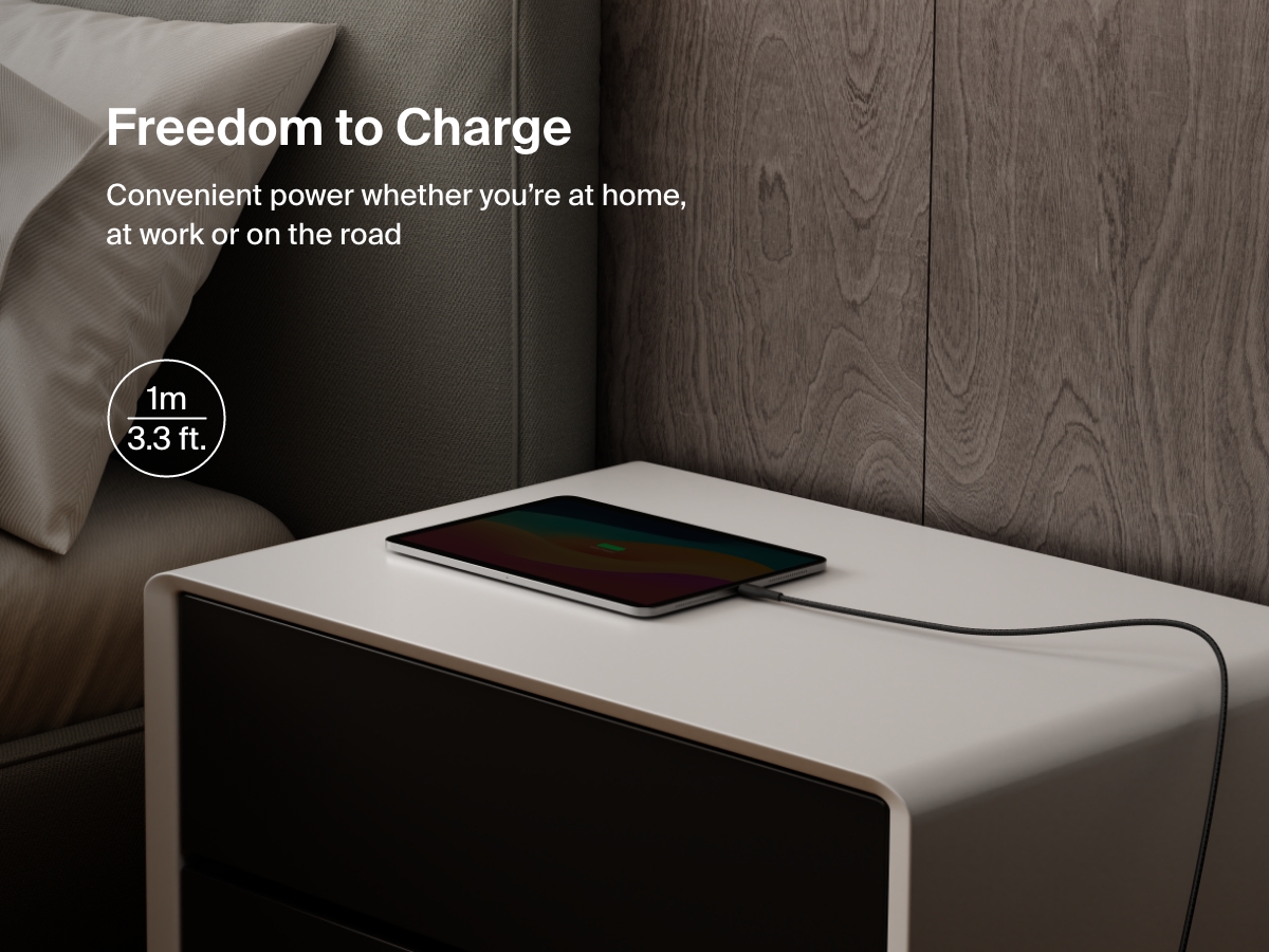 Belkin BoostCharge Pro USB-C to USB-C Braided Cable 240W shown charging a tablet on a nightstand, emphasizing its 1-meter (3.3 ft) length for convenient charging anywhere.
