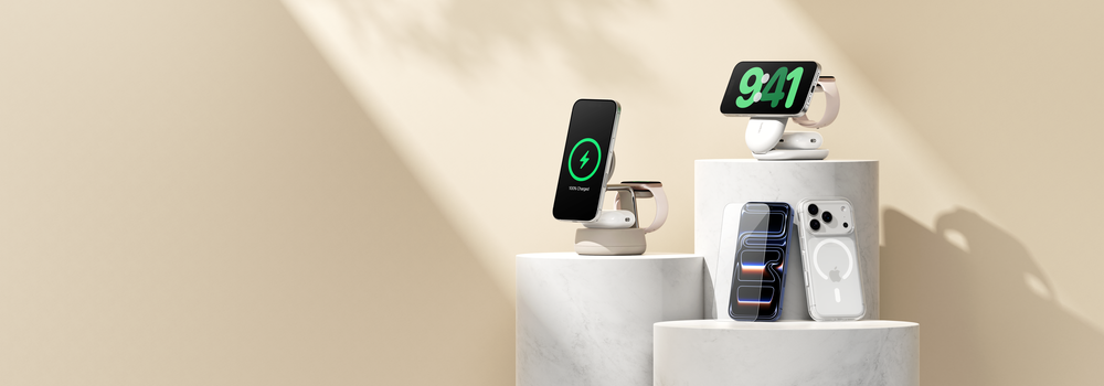 Belkin charging stands displayed on marble pedestals with iPhones charging wirelessly, shown in various orientations against a beige background.