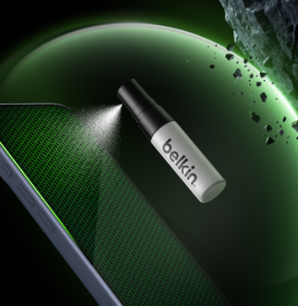 Belkin spray applied to smartphone screen with green protective layer, illustrating liquid screen protection and enhanced durability.