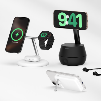 Essential tech accessories for the iPhone 16, including wireless charging stands, Apple Watch charging stations, and Belkin earbuds, displayed on a white surface.