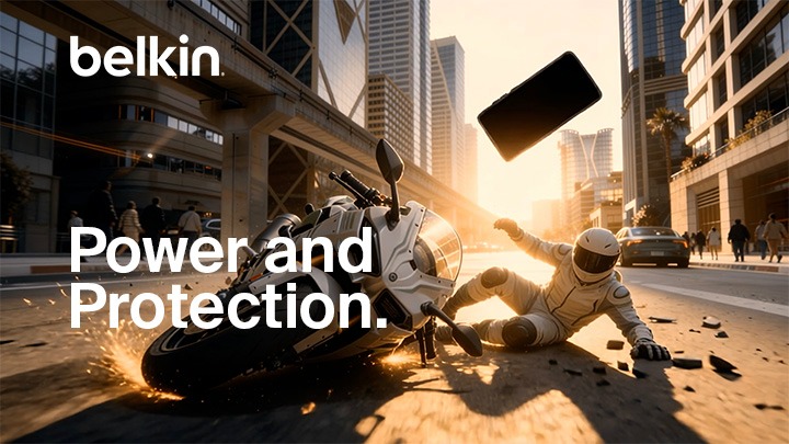 Belkin &ldquo;Power and Protection&rdquo; video thumbnail showing a motorcyclist sliding on a city street as a smartphone flies through the air, emphasizing durability and device protection.