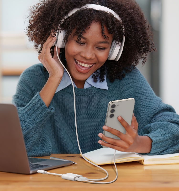 Listen to music and charge your device with Belkin RockStar USB-C Audio + Charge Adapter.