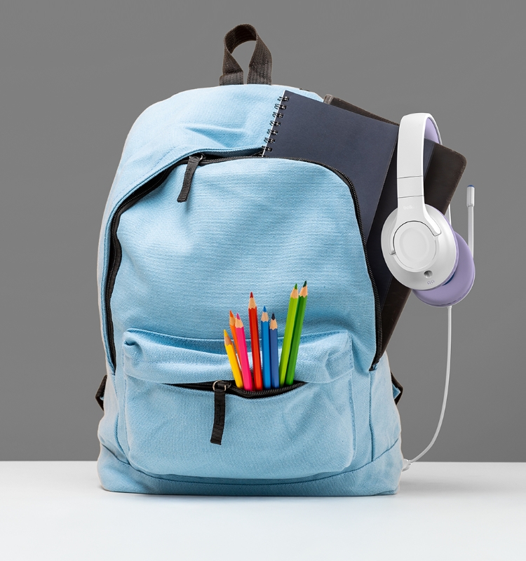 A blue bag that contains a headphone, books, and some pens.