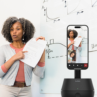 A woman teaching a class and have the Belkin Auto Tracking Stand Pro with Dockkit captures her.