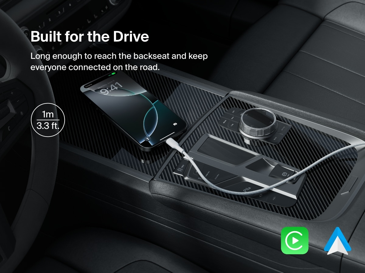 A 1-meter (3.3 ft) Belkin BoostCharge Pro Braided USB-A to USB-C Cable 15W charges a smartphone in a car, offering extended reach and seamless compatibility with Apple CarPlay and Android Auto.