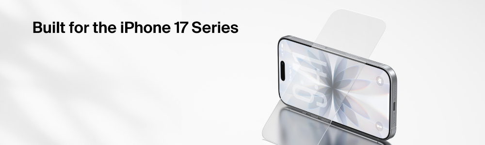 A smartphone lying on a reflective surface with a transparent screen protector partially placed over the display, showcasing its precise fit and clear finish.