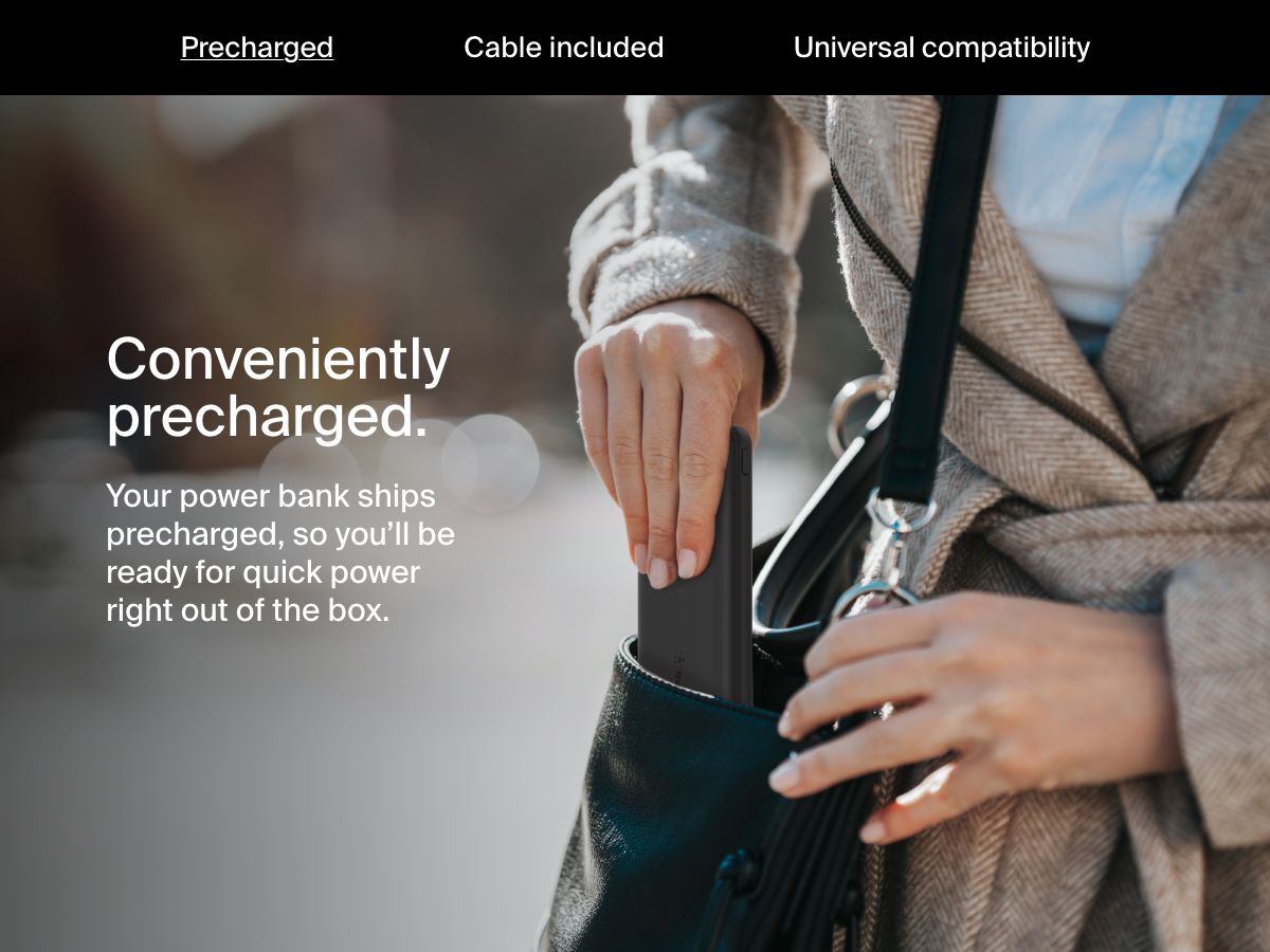 A woman places a black Belkin BoostCharge Power Bank 10K into her handbag, highlighting its precharged convenience for immediate use right out of the box.