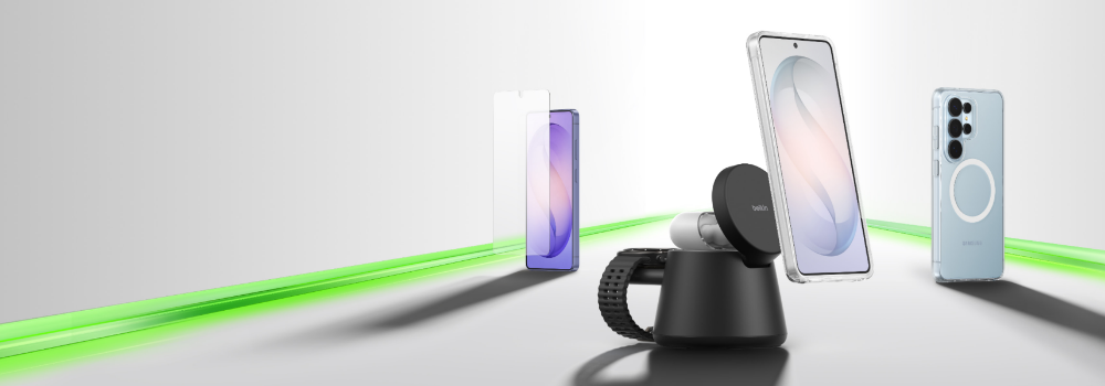 A lineup of smartphone accessories on a clean surface, including a screen protector, a phone on a magnetic charging stand, and a phone in a protective case, arranged along a glowing green accent line.
