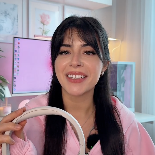 Marissa Leigh is showing the SoundForm Isolate headphones.