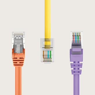 The image displays three Ethernet cables with connectors in different colors:  1. **Left**: An orange Ethernet cable. 2. **Middle**: A yellow Ethernet cable. 3. **Right**: A purple Ethernet cable.  Each cable is shown in close-up, focusing on the connectors and internal wiring, set against a neutral, light background.