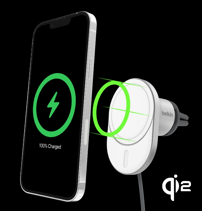 The image shows an iPhone with a "100% Charged" icon aligning magnetically with the BoostCharge Pro Magnetic Wireless Car Charger with Qi2 15W, which features a Qi2 logo and vent mount attachment.